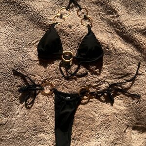 Black thong bikini with gold ring accents
